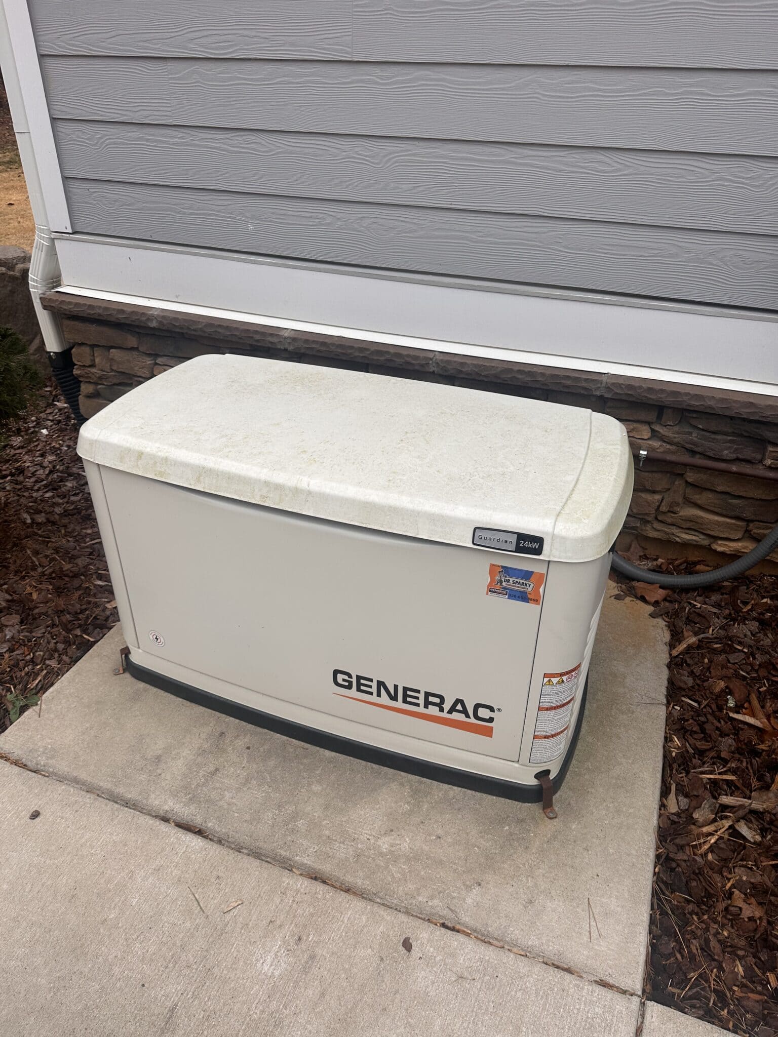 Residential generator for backup power supply outside the house.